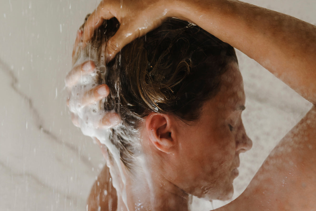 Washing hair with BARAU organic solid shampoo