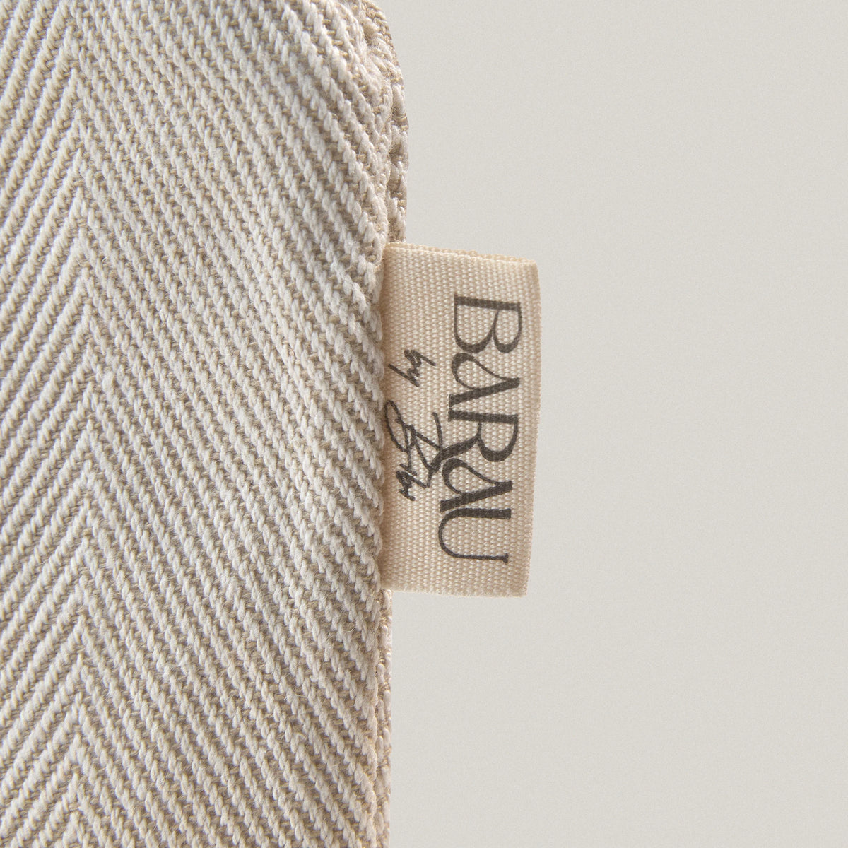 BARAU logo on the cotton fabric of the Carry the Calm cosmetic bag