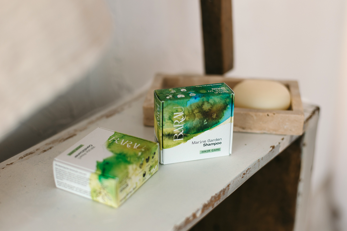 Purifying Hair Routine: solid shampoo and conditioner with packaging in the bathroom